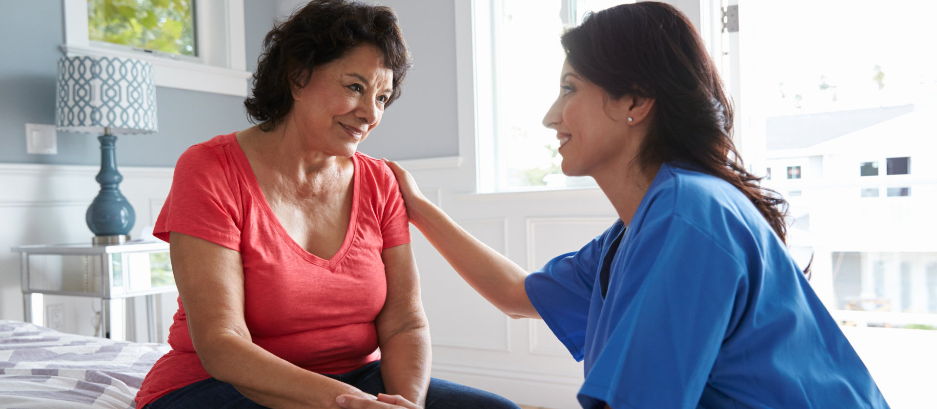  Nurse Making Home Visit To Senior Hispanic Woman